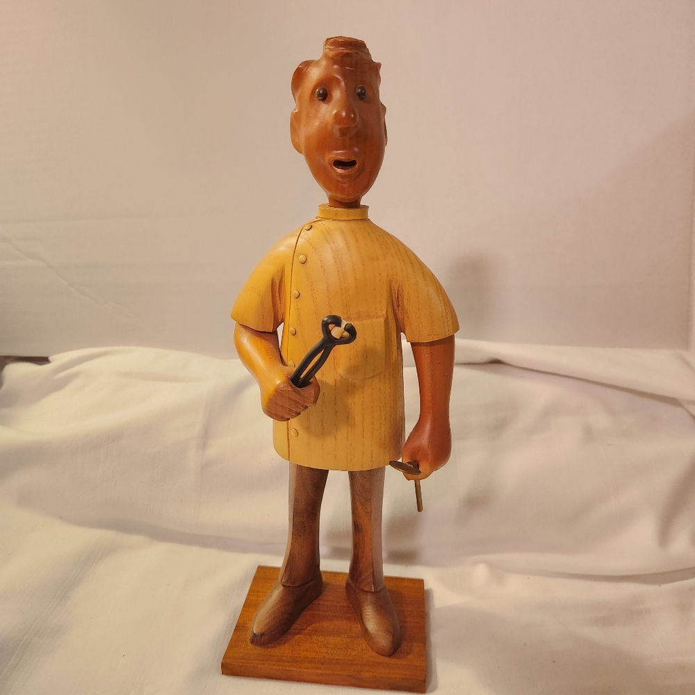 Romer Handcrafted Wooden Figurine Dentist With Extracted Tooth  Brown